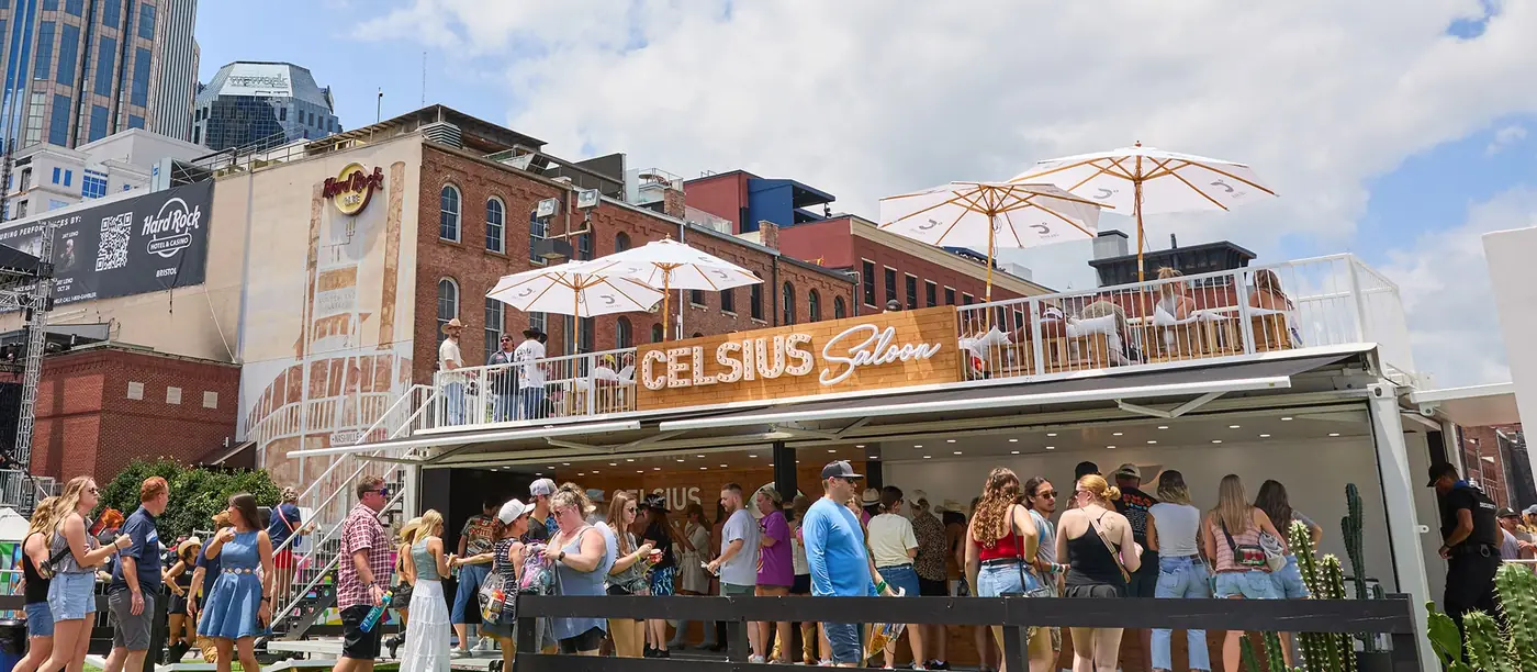 Celsius Saloon, a two-storey SS 40 unit with a rooftop lounge, surrounded by festival crowds in Nashville