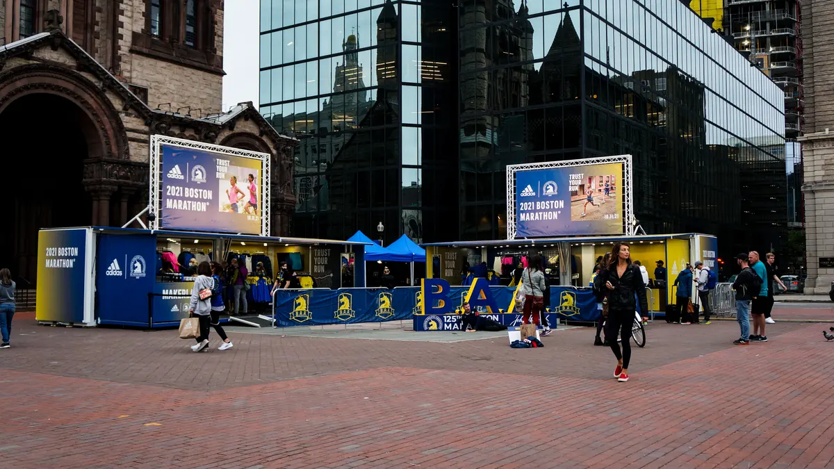 Several branded retail units deployed across a city plaza